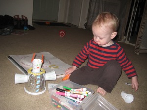 My drippy snotty drooly sick baby, coloring and hanging out with the awesome robot we made.