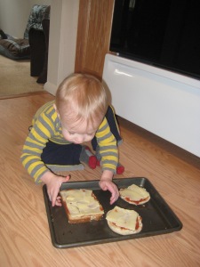 He was all set to eat them, but I explained that they needed to go in the oven to get warm and melty.