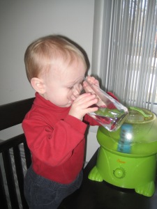 "Look, I can drink from Daddy's big glass!"
