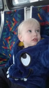 He couldn't stop looking all around the bus. He hardly sat still because he was so busy swiveling around trying to see everything and take it all in!