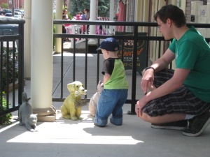 Checking out some animal statues outside a shop.