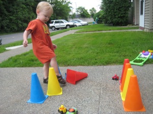 I built an obstacle course with rows of cones for him to step over. His solution? Kick them down!