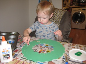 Squirting glue and placing decorations takes great concentration.