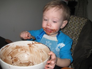 Scraping the last bits of yumminess from the bowl after making brownies.